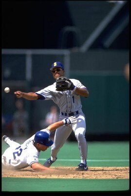 7 Jun 1992: KANSAS CITY ROYALS RUNNER RICO ROSSY (LEFT) SLIDES INTO SECOND BASE AS SEATTLE MARINERS INFIELDER GREG BRILEY ATTEMPTS TO TURN A DOUBLE PLAY AT ROYALS STADIUM IN KANSAS CITY, MISSOURI.
