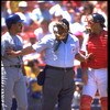 26 Apr 1992: AMERICAN LEAGUE UMPIRE, UMP ROCKY (MIDDLE) BREAKS UP SEATTLE MARINERS BATTER HENRY COTTO (LEFT) AND CALIFORNIA ANGELS CATCHER LANCE PARRISH (RIGHT) FROM ARGUING DURING THE ANGELS GAME AT ANAHEIM STADIUM IN ANAHEIM, CALIFORNIA.