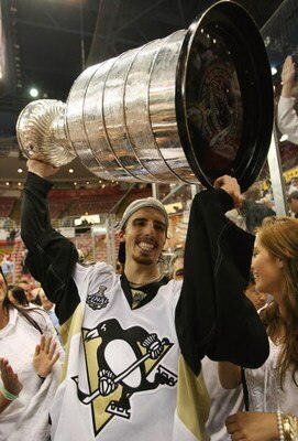 DETROIT - JUNE 12:  Marc-Andre Fleury #29 of the Pittsburgh Penguins holds the Stanley Cup following the Penguins victory over the Detroit Red Wings in Game Seven of the 2009 NHL Stanley Cup Finals at Joe Louis Arena on June 12, 2009 in Detroit, Michigan.