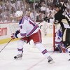 PITTSBURGH - APRIL 25: Marc Staal #18 of the New York Rangers holds off Ryan Malone #12 of the Pittsburgh Penguins as Staal attempts to control the puck during game one of the Eastern Conference Semifinals of the 2008 NHL Stanley Cup Playoffs on April 25,
