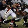 CHICAGO - DECEMBER 07: Matt Forte #22 of the Chicago Bears is tackled by Paul Spicer #95 of the Jacksonville Jaguars on December 7, 2008 at Soldier Field in Chicago, Illinois. The Bears defeated the Jaguars 23-10. (Photo by Jonathan Daniel/Getty Images)