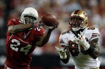 GLENDALE, AZ - NOVEMBER 10:  Adrian Wilson #24 of the Arizona Cardinals breaks up a pass to Vernon Davis #85 of the San Francisco 49ers during the fourth quarter at University of Phoenix Stadium on November, 10 2008 in Glendale, Arizona.  (Photo by Harry 