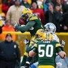 GREEN BAY, WI - DECEMBER 28: Nick Collins #36 of the Green Bay Packers leaps to intercept a pass against the Detroit Lions on December 28, 2008 at Lambeau Field in Green Bay, Wisconsin. The Packers defeated the Lions 31-21. (Photo by Jonathan Daniel/Getty