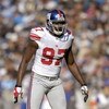CHARLOTTE, NC - DECEMBER 10: Mathias Kiwanuka #97 of the New York Giants gets ready on the field during the game against the Carolina Panthers on December 10, 2006, at Bank of America Stadium in Charlotte, North Carolina. (Photo By Grant Halverson/Getty I