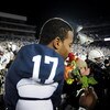 STATE COLLEGE, PA - NOVEMBER 22:  Darryl Clark #17 of the Penn State Nittany Lions smells a rose after clinching the Big Ten title and clinching a bid to the Rose Bowl after the game against the Michigan State Spartans on November 22, 2008 at Beaver Stadi