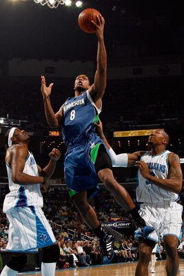 NEW ORLEANS - FEBRUARY 08:  Ryan Gomes #8 of the Minnesota Timberwolves  makes a shot over James Posey #41 and David West #30 of the New Orleans Hornets on February 8, 2009 in New Orleans, Louisiana.  NOTE TO USER: User expressly acknowledges and agrees t