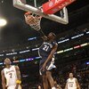 LOS ANGELES - APRIL 12: Hakim Warrick #21 of the Memphis Grizzlies dunks over Lamar Odom #7 of the Los Angeles Lakers on April 12, 2009 at Staples Center in Los Angeles, California. The Lakers won 92-75. NOTE TO USER: User expressly acknowledges and agree