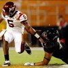 MIAMI - JANUARY 01:  John Hughes # 40 of the Cincinnati Bearcats tackles Tyrod Taylor #5 of the Virginia Tech Hokies as he loses the ball during the FedEx Orange Bowl at Dolphin Stadium on January 1, 2009 in Miami, Florida.  (Photo by Streeter Lecka/Getty