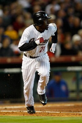 HOUSTON - APRIL 06:  Michael Bourn #21 of the Houston Astros runs to first against the Chicago Cubs during the Opening Day game on April 6, 2009 at Minute Maid Park in Houston, Texas.  (Photo by Chris Graythen/Getty Images)