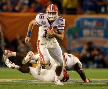 MIAMI - JANUARY 08:  Tim Tebow #15 of the Florida Gators runs the ball against the Oklahoma Sooners during the FedEx BCS National Championship game at Dolphin Stadium on January 8, 2009 in Miami, Florida.  (Photo by Doug Benc/Getty Images)