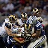 ST. LOUIS, MO - OCTOBER 19: Marc Bulger #10 of the St. Louis Rams is tackled by Greg Ellis #98 of the Dallas Cowboys at the Edward Jones Dome on October 19, 2008 in St. Louis, Missouri.  (Photo by Dilip Vishwanat/Getty Images)
