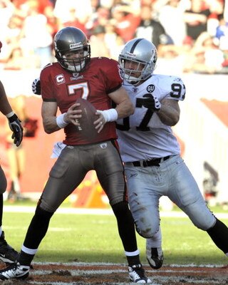 TAMPA, FL - DECEMBER 28: Defensive end Greyson Gunheim #97 of the Oakland Raiders sacks quarterback Jeff Garcia #7 of the Tampa Bay Buccaneers at Raymond James Stadium on December 28, 2008 in Tampa, Florida.  (Photo by Al Messerschmidt/Getty Images)