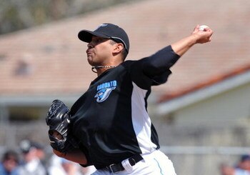DUNEDIN, FL - FEBRUARY 25 :  Pitcher Ricky Romero of the Toronto Blue Jays throws against the New York Yankees February 25, 2009 at Dunedin Stadium in Dunedin, Florida.  (Photo by Al Messerschmidt/Getty Images)