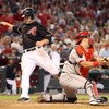 PHOENIX - JUNE 27:  Mark Reynolds #27 of the Arizona Diamondbacks scores a run past catcher Mike Napoli #44 of the Los Angeles Angels of Anaheim during the fourth inning of the major league baseball game at Chase Field on June 27, 2009 in Phoenix, Arizona