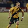 CARSON, CA - NOVEMBER 1:   Simon Elliott #12 of the Los Angeles Galaxy dribbles against the San Jose Earthquakes during the first round of the MLS Playoffs on November 1, 2003 in Torrance, California.  The Galaxy defeated the Earthquakes 2-0.  (Photo by D