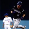 LOS ANGELES, CA - JUNE 30:  Brad Hawpe #11 of the Colorado Rockies rounds the bases after hitting a home run against the Los Angeles Dodgers at Dodger Stadium on June 30, 2009 in Los Angeles, California.  (Photo by Jeff Gross/Getty Images)