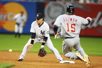 NEW YORK - JUNE 18:  Ramiro Pena #19 of The New York Yankees tags out Cristian Guzman #15 of The Washington Nationals on an attempted steal during their game on June 18th, 2009 at Yankee Stadium in the Bronx Borough of New York.  (Photo by Al Bello/Getty 