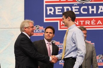 MONTREAL - JUNE 26:  President & GM Glen Sather of the New York Rangers shakes hands with draft pick Chris Kreider while Professional Scout Jeff Gorton looks on during the first round of the 2009 NHL Entry Draft at the Bell Centre on June 26, 2009 in Mont
