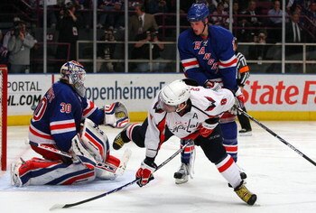 NEW YORK - APRIL 22:  Henrik Lundqvist #30 and Marc Staal #18 of the New York Rangers defend against Alex Ovechkin #8 of the Washington Capitals during Game Four of the Eastern Conference Quarterfinal Round of the 2009 NHL Stanley Cup Playoffs on April 22