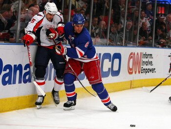 NEW YORK - APRIL 22:  Wade Redden #6 of the New York Rangers defends against Boyd Gordon #15 of the Washington Capitals  during Game Four of the Eastern Conference Quarterfinal Round of the 2009 NHL Stanley Cup Playoffs on April 22, 2008 at Madison Square