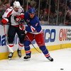 NEW YORK - APRIL 22:  Wade Redden #6 of the New York Rangers defends against Boyd Gordon #15 of the Washington Capitals  during Game Four of the Eastern Conference Quarterfinal Round of the 2009 NHL Stanley Cup Playoffs on April 22, 2008 at Madison Square