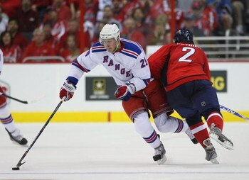 WASHINGTON - APRIL 18:  Lauri Korpikoski #29 of the New York Rangers skates past Brian Pothier #2 of the Washington Capitals during Game Two of the Eastern Conference Quarterfinal Round of the 2009 NHL Stanley Cup Playoffs at Verizon Center on April 18, 2
