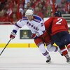WASHINGTON - APRIL 18:  Lauri Korpikoski #29 of the New York Rangers skates past Brian Pothier #2 of the Washington Capitals during Game Two of the Eastern Conference Quarterfinal Round of the 2009 NHL Stanley Cup Playoffs at Verizon Center on April 18, 2