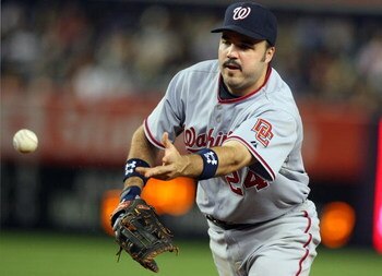 NEW YORK - JUNE 17:  Nick Johnson #24 of the Washington Nationals flips the ball to first base for an out against the New York Yankees on June 17, 2009 at Yankee Stadium in the Bronx borough of New York City. The Nationals defeated the Yankees 3-2.  (Phot