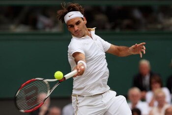 WIMBLEDON, ENGLAND - JULY 03:  Roger Federer of Switzerland plays a forehand during the men's singles semi final match against Tommy Haas of Germany on Day Eleven of the Wimbledon Lawn Tennis Championships at the All England Lawn Tennis and Croquet Club o