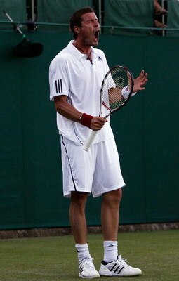 WIMBLEDON, ENGLAND - JUNE 23:  Marat Safin of Russia reacts during the men's singles first round match against Jesse Levine of USA on Day Two of the Wimbledon Lawn Tennis Championships at the All England Lawn Tennis and Croquet Club on June 23, 2009 in Lo