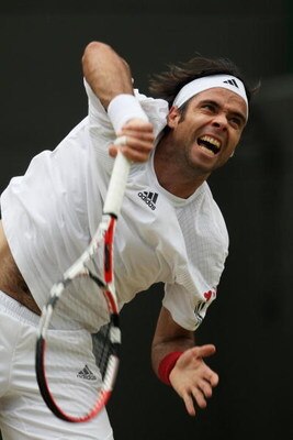 WIMBLEDON, ENGLAND - JUNE 27:  Fernando Gonzalez of Chile serves during the men's singles third round match against Juan Carlos Ferrero of Spainon Day Six of the Wimbledon Lawn Tennis Championships at the All England Lawn Tennis and Croquet Club on June 2