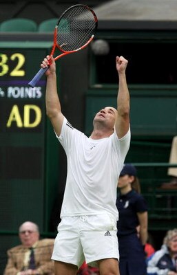 LONDON, ENGLAND - MAY 17:  Andre Agassi celebrates during the Mens Singles match againstTim Henman during the 'Centre Court Celebration' at Wimbledon on May 17, 2009 in London, England.  (Photo by Hamish Blair/Getty Images)