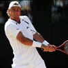 WIMBLEDON, ENGLAND - JULY 01:  Lleyton Hewitt of Australia plays a backhand during the men's singles quarter final match against Andy Roddick of USA on Day Nine of the Wimbledon Lawn Tennis Championships at the All England Lawn Tennis and Croquet Club on 