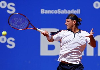 BARCELONA, SPAIN - APRIL 23:  David Nalbandian of Argentina returns a backhand to Nicolas Almagro of Spain on day four of the ATP 500 World Tour Barcelona Open Banco Sabadell 2009 tennis tournament at the Real Club de Tenis on April 23, 2009 in Barcelona,