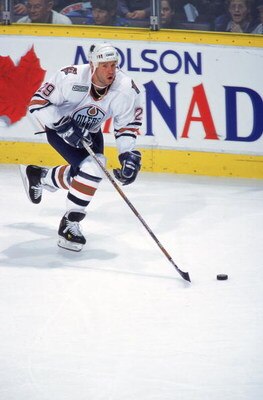 16 Apr 2000: Alexander Selivanov #29 of the Edmonton Oilers skating down the ice with the puck during the game against the Dallas Stars at the Skyreach Centre in Edmonton, Alberta, Canada. The Stars defeated the Oilers 5-2.