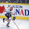 16 Apr 2000: Alexander Selivanov #29 of the Edmonton Oilers skating down the ice with the puck during the game against the Dallas Stars at the Skyreach Centre in Edmonton, Alberta, Canada. The Stars defeated the Oilers 5-2.