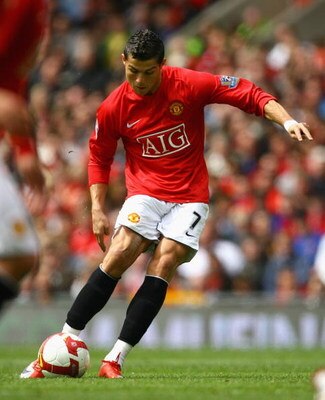 MANCHESTER, ENGLAND - MAY 10: Cristiano Ronaldo of Manchester United scores the opening goal during the Barclays Premier League match between Manchester United and Manchester City at Old Trafford on May 10, 2009 in Manchester, England. (Photo by Alex Li