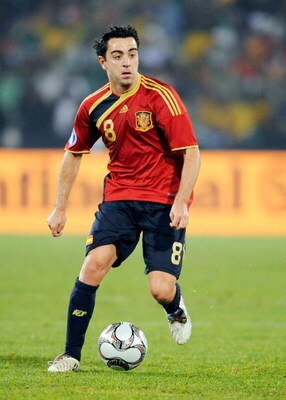 BLOEMFONTEIN, SOUTH AFRICA - JUNE 20:  Xavi Hernandez of Spain runs with the ball during the FIFA Confederations Cup match between Spain and South Africa at the Free State stadium on June 20, 2009 in Bloemfontein, South Africa.  (Photo by Kevork Djansezia
