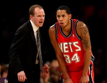 LOS ANGELES, CA - NOVEMBER 25:  Head coach Lawrence Frank and Devin Harris #34 of the New Jersey Nets confer during the game with the Los Angeles Lakers on November 25, 2008 at Staples Center in Los Angeles, California. The Lakers won 120-93.   NOTE TO US