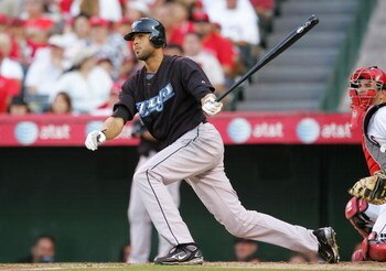 ANAHEIM, CA - JULY 05:  Alex Rios #15 of the Toronto Blue Jays hits a two RBI single in the third inning against the Los Angeles Angels of Anaheim at Angels Stadium on July 5, 2008 in Anaheim, California.  (Photo by Lisa Blumenfeld/Getty Images)