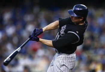 LOS ANGELES, CA - JUNE 30:  Brad Hawpe # 11 of the Colorado Rockies hits a home run in the fourth inning against the Los Angeles Dodgers at Dodger Stadium on June 30, 2009 in Los Angeles, California. (Photo by Jeff Gross/Getty Images)