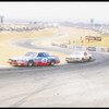 Richard Petty, driver of the #43 STP car is chased by Bobby Allison #22 during a Nascar Winston Cup race at the Riverside Raceway in Riverside, California. (Image by Mike Powell/Getty Images)