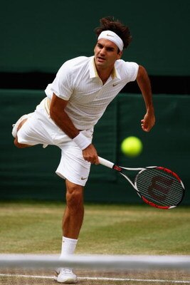 WIMBLEDON, ENGLAND - JULY 03:  Roger Federer of Switzerland serves during the men's singles semi final match against Tommy Haas of Germany on Day Eleven of the Wimbledon Lawn Tennis Championships at the All England Lawn Tennis and Croquet Club on July 3, 