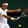 WIMBLEDON, ENGLAND - JULY 03:  Roger Federer of Switzerland plays a backhand during the men's singles semi final match against Tommy Haas of Germany on Day Eleven of the Wimbledon Lawn Tennis Championships at the All England Lawn Tennis and Croquet Club o