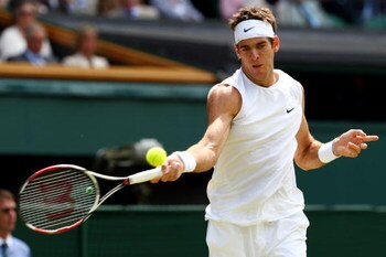 WIMBLEDON, ENGLAND - JUNE 25:  Juan Martin Del Potro of Argentina plays a forehand during the men's singles second round match against Lleyton Hewitt of Australia on Day Four of the Wimbledon Lawn Tennis Championships at the All England Lawn Tennis and Cr