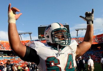 MIAMI - NOVEMBER 09:  Offensive lineman Samson Satele #64 of the Miami Dolphins celebrates his team's victory over the Seattle Seahawks at Dolphin Stadium on November 9, 2008 in Miami, Florida. The Dolphins defeated the Seahawks 21-19.  (Photo by Doug Ben