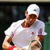 WIMBLEDON, ENGLAND - JULY 01:  Novak Djokovic of Serbia plays backhand during the men's singles quarter final match against Tommy Haas of Germany on Day Nine of the Wimbledon Lawn Tennis Championships at the All England Lawn Tennis and Croquet Club on Jul