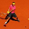 PARIS - MAY 29:  Rafael Nadal of Spain hits a backhand during his Men's Singles Third Round match against Lleyton Hewitt of Australia on day six of the French Open at Roland Garros on May 29, 2009 in Paris, France.  (Photo by Clive Brunskill/Getty Images)