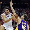 HOUSTON - MAY 14:  Forward Luis Scola #4 of the Houston Rockets drives the hoop against Pau Gasol #16 of the Los Angeles Lakers in Game Six of the Western Conference Semifinals during the 2009 NBA Playoffs at Toyota Center on May 14, 2009 in Houston, Texa