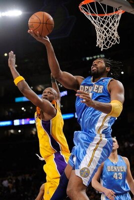 LOS ANGELES, CA - MAY 27:  Nene #31 of the Denver Nuggets goes up for a shot against Lamar Odom #7 of the Los Angeles Lakers in Game Five of the Western Conference Finals during the 2009 NBA Playoffs at Staples Center on May 27, 2009 in Los Angeles, Calif